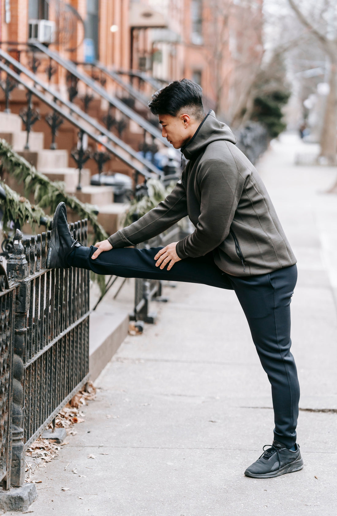 Runner stretching a leg before running